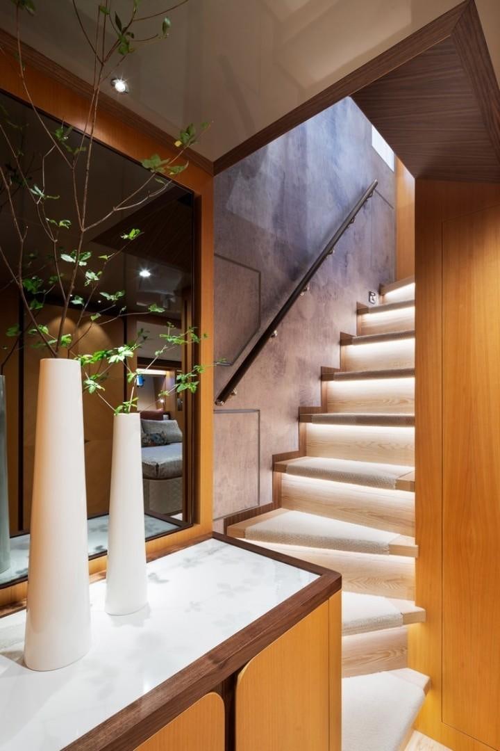 a staircase with a plant in the background aboard PARABOLIC Yacht for Sale