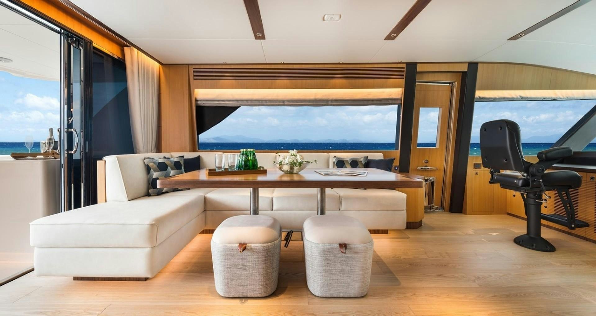 a room with a table chairs and a large window aboard PARABOLIC Yacht for Sale