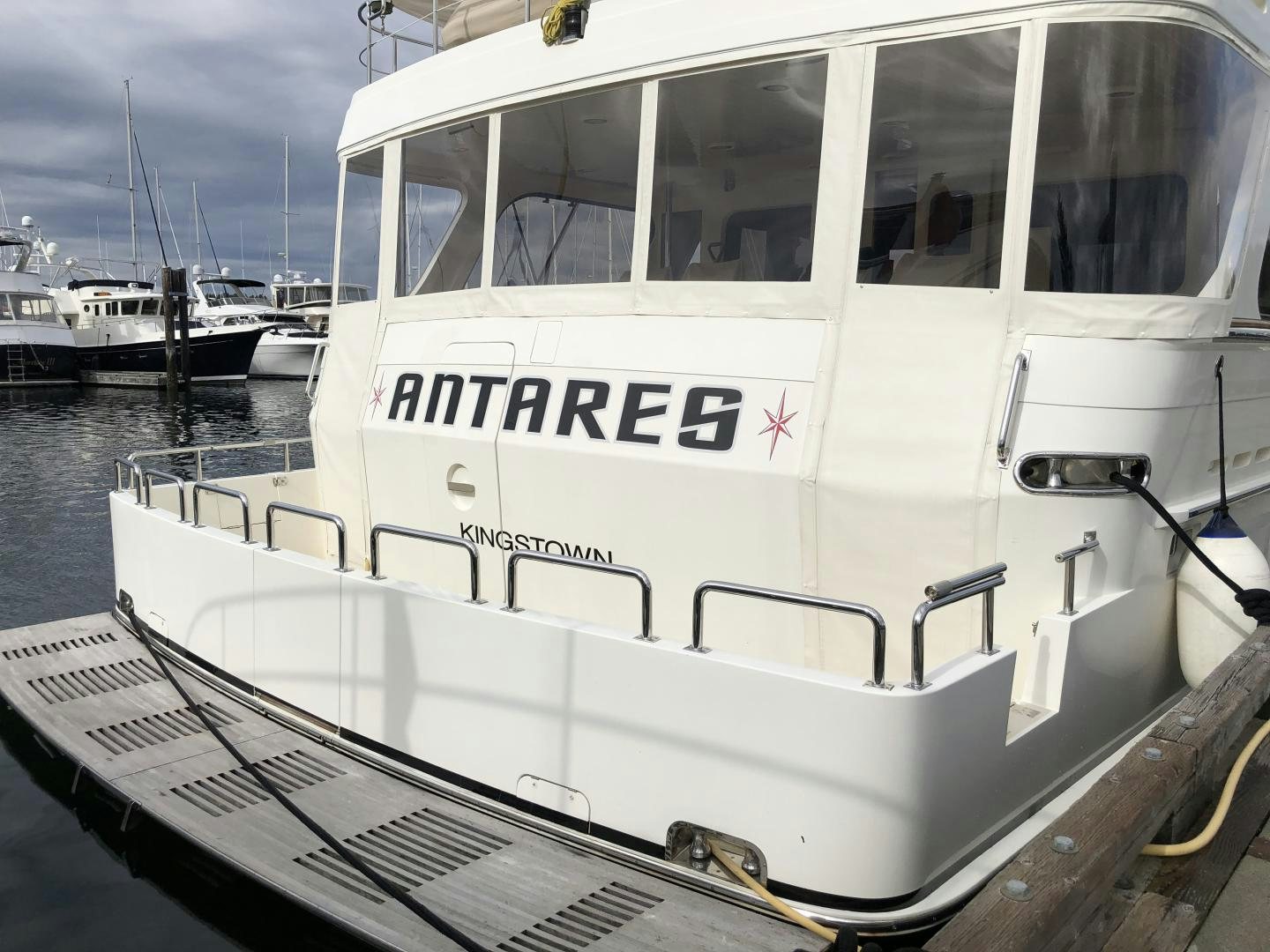 a white boat in the water aboard ANTARES Yacht for Sale