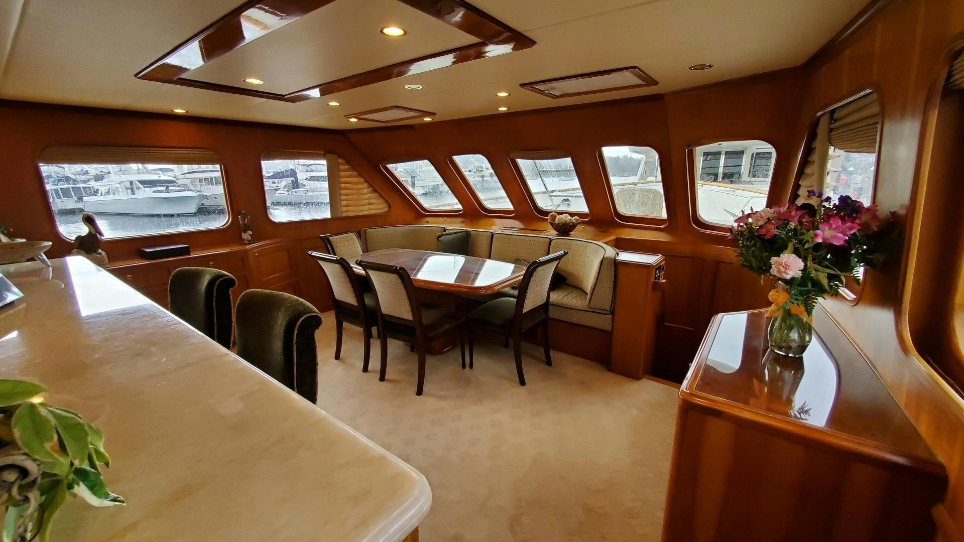 a restaurant with tables and chairs aboard ANTARES Yacht for Sale