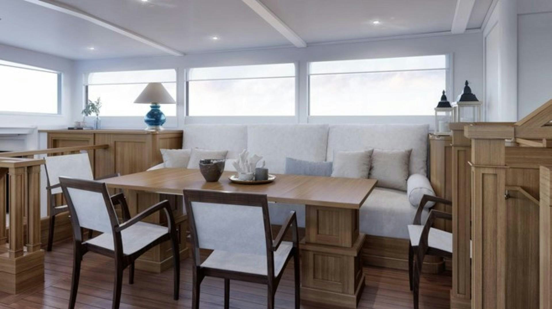 a dining table in a kitchen aboard ARK 401 Yacht for Sale