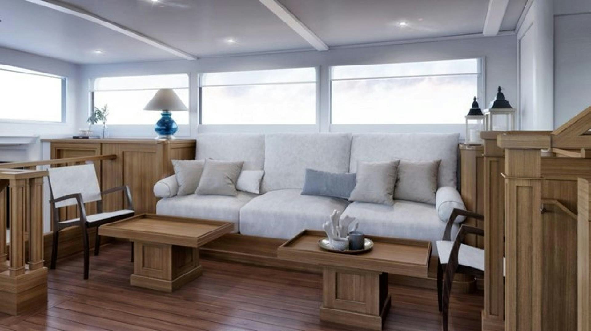 a living room with a white couch aboard ARK 401 Yacht for Sale