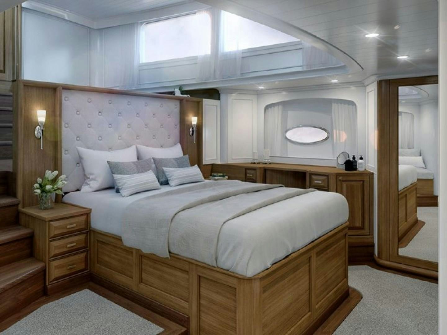 a bedroom with a large bed aboard ARK 401 Yacht for Sale
