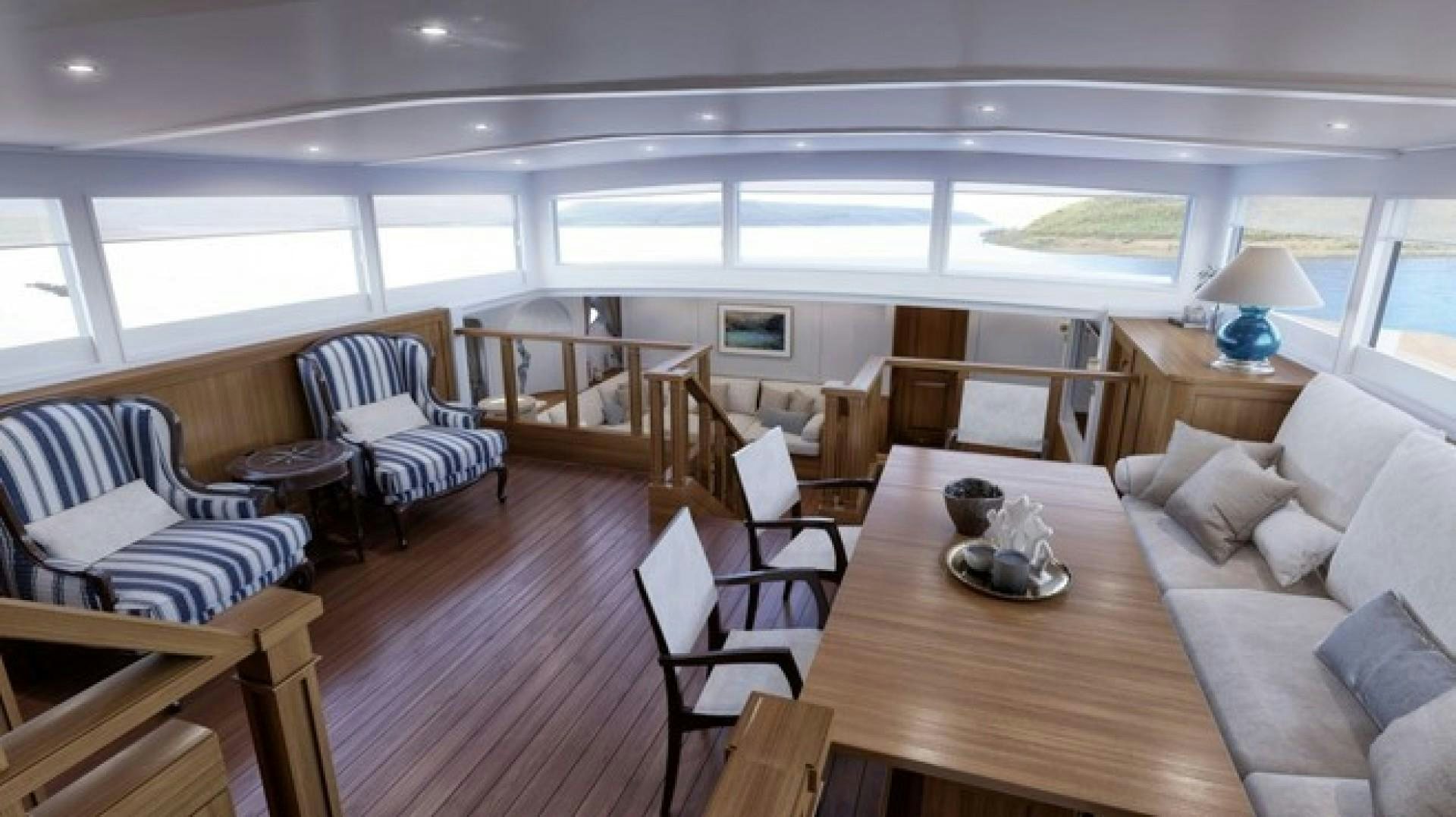 a living room with a wood floor aboard ARK 401 Yacht for Sale
