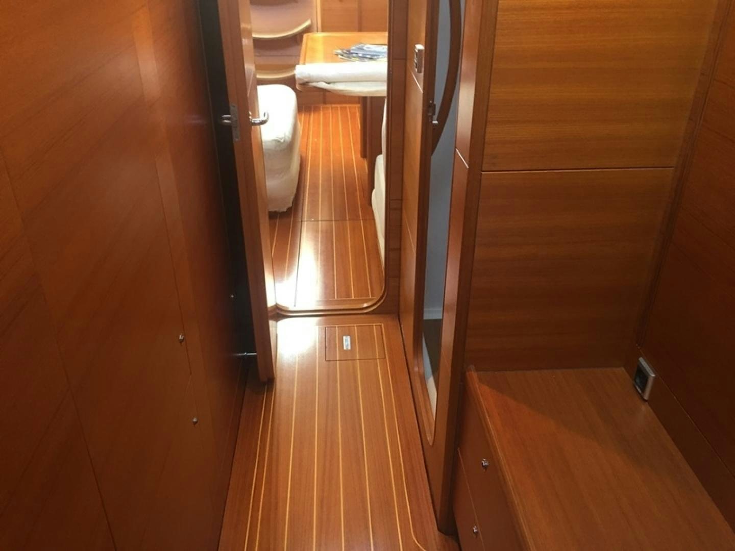 a room with wooden floors aboard XERES Yacht for Sale