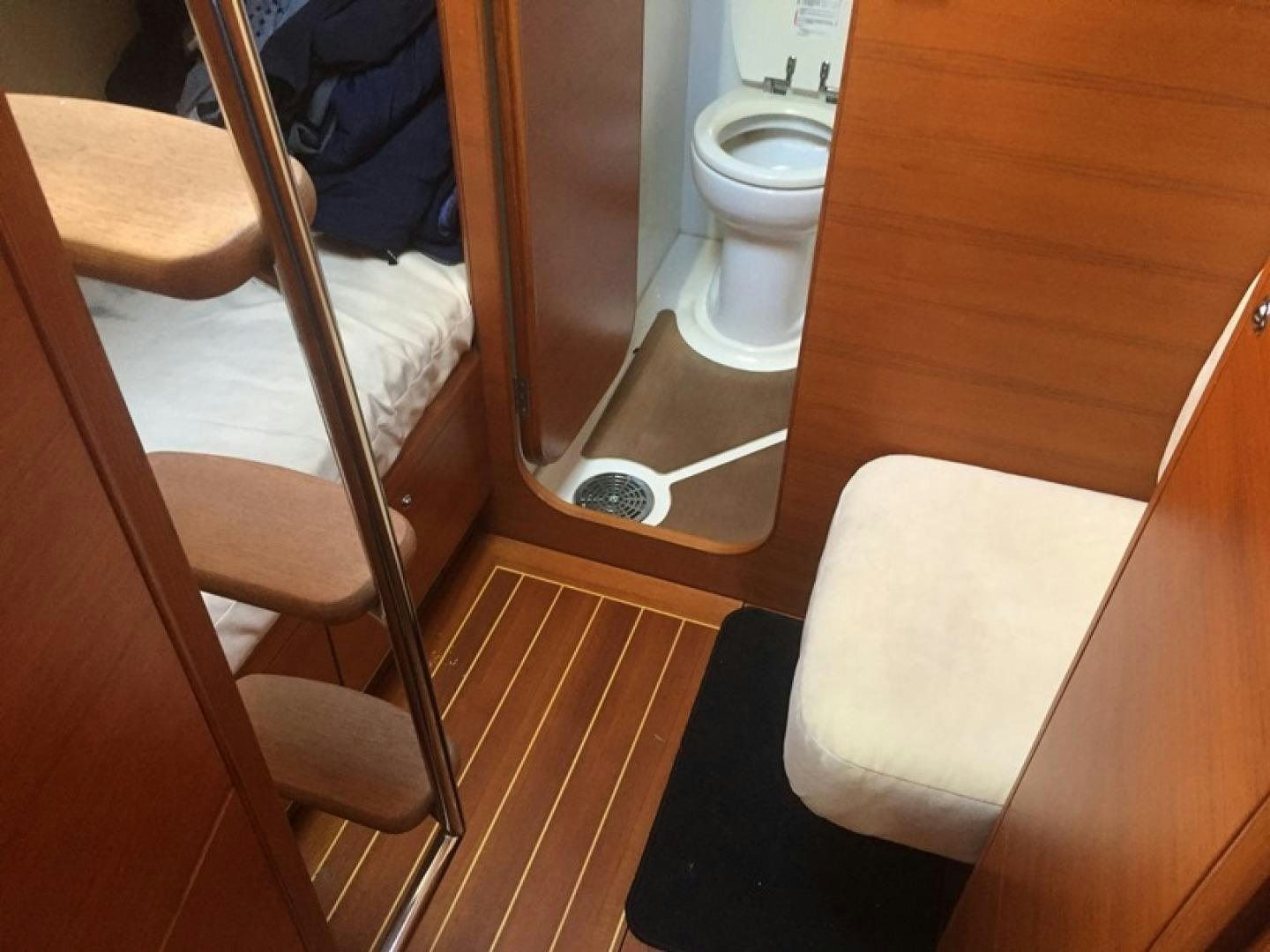 a bathroom with a toilet and a sink aboard XERES Yacht for Sale