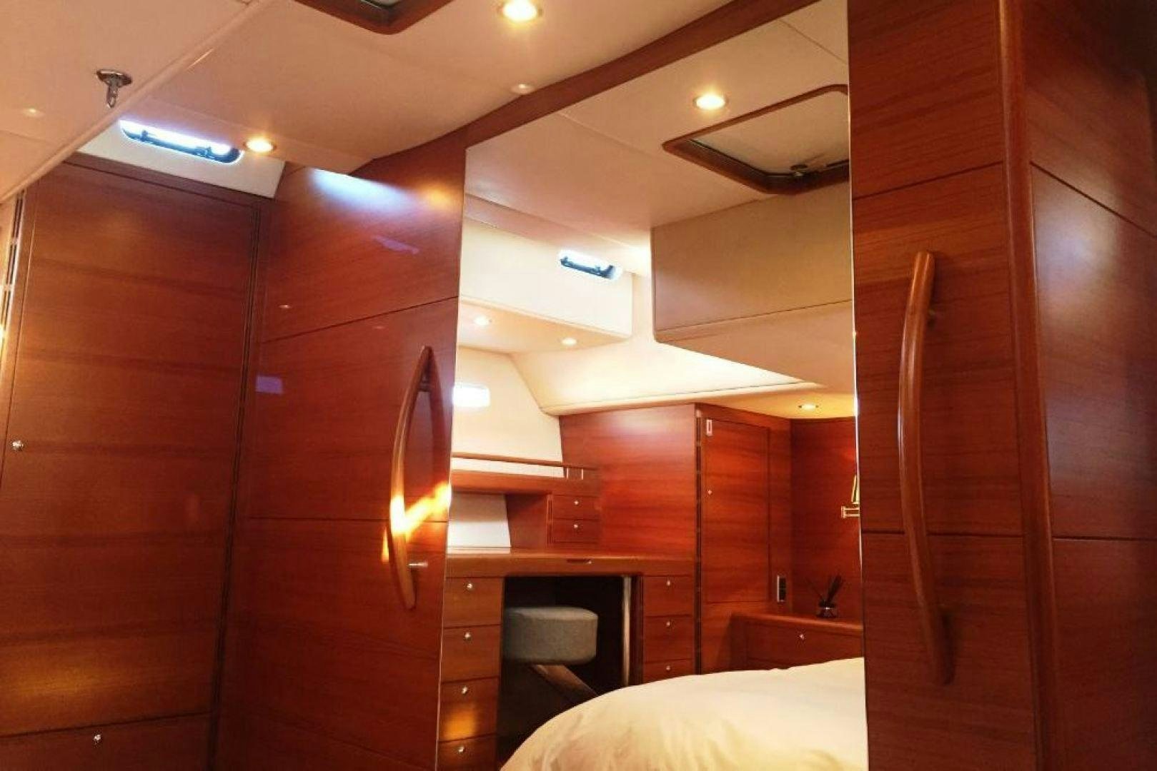 a room with wooden cabinets aboard XERES Yacht for Sale