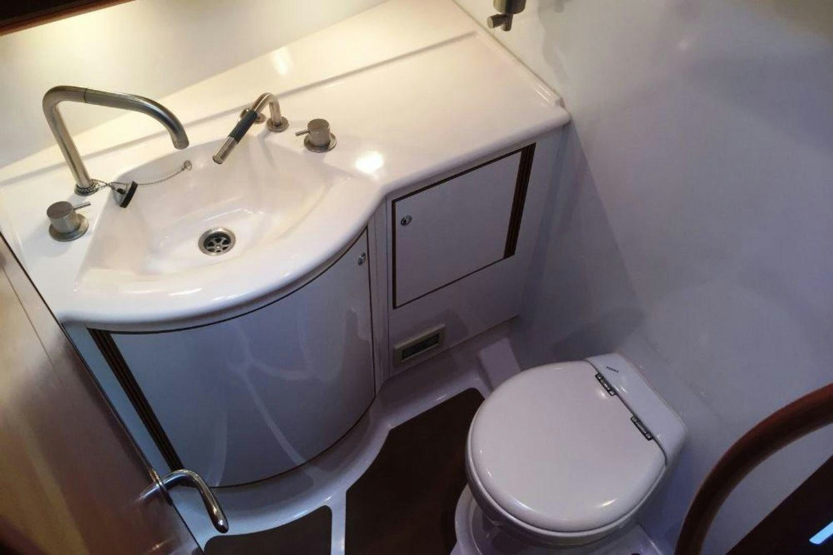 a sink and toilet in a bathroom aboard XERES Yacht for Sale