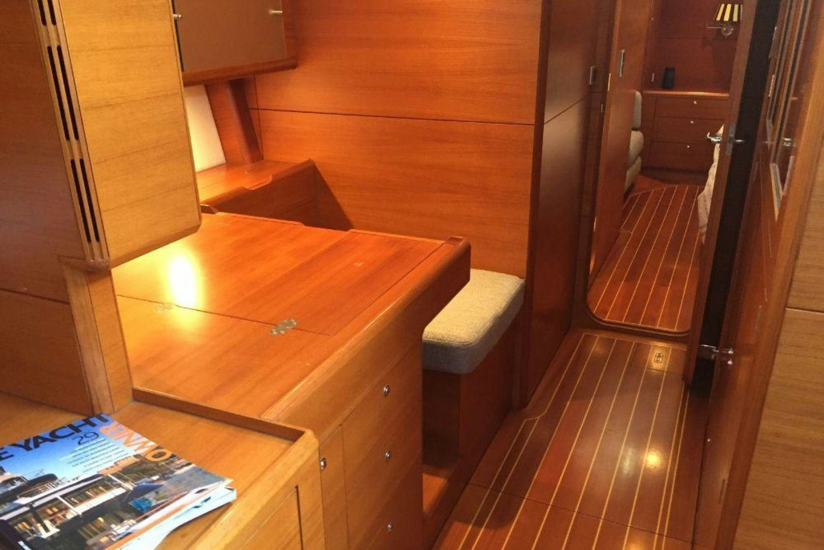 a wooden table with a box on top of it aboard XERES Yacht for Sale