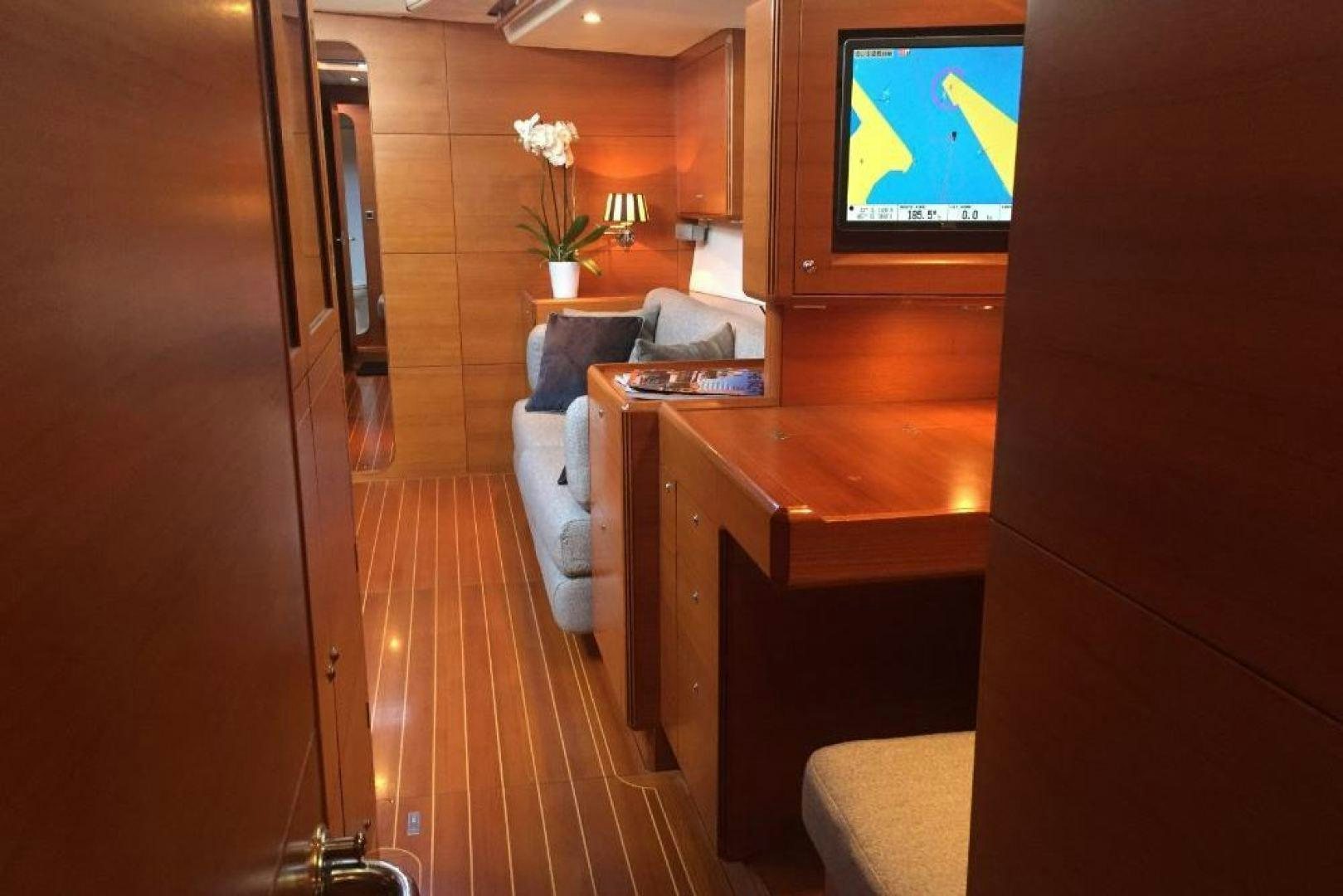 a room with a tv and a couch aboard XERES Yacht for Sale