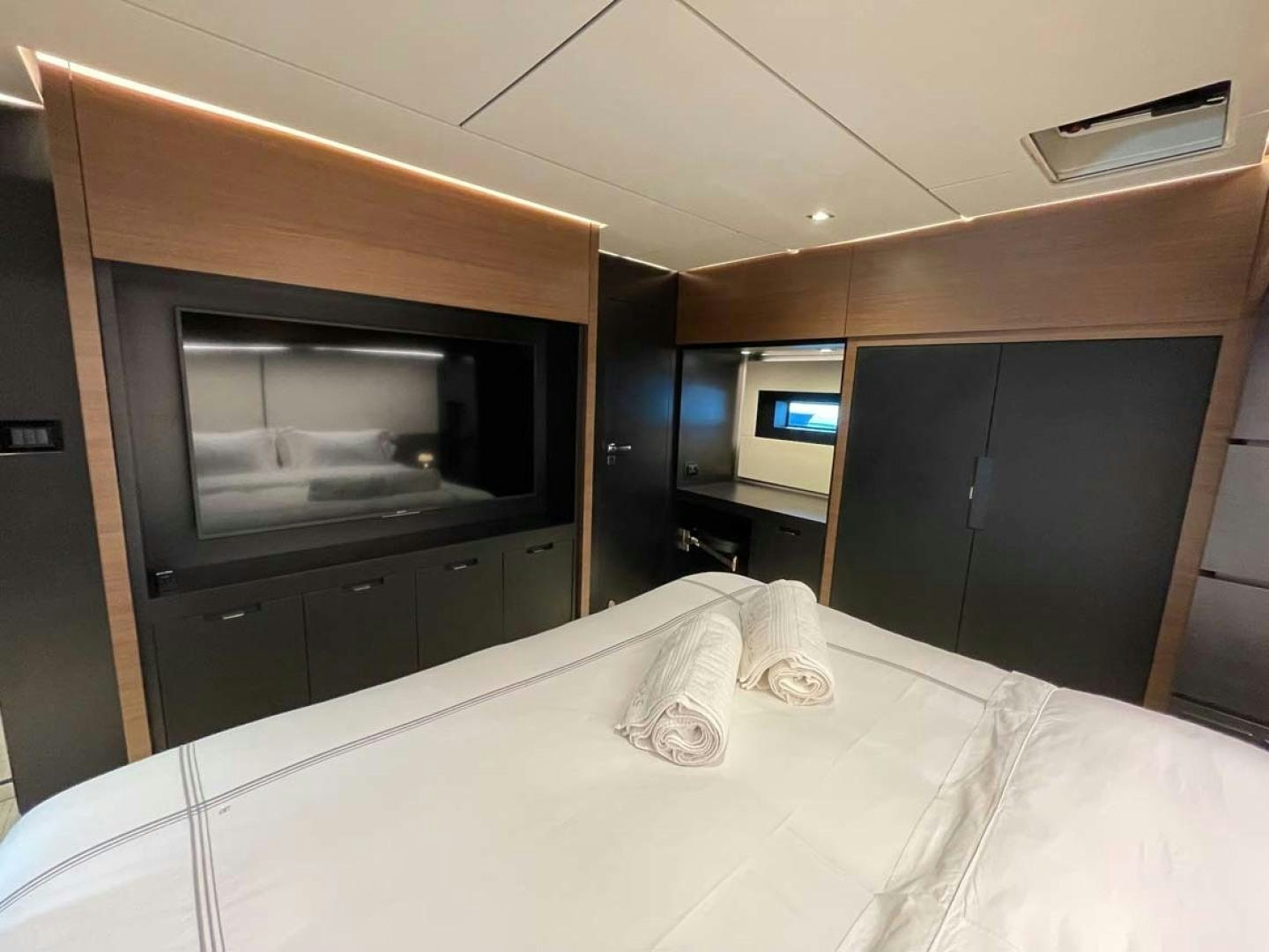 a bed with a white sheet aboard LAS BRISAS Yacht for Sale