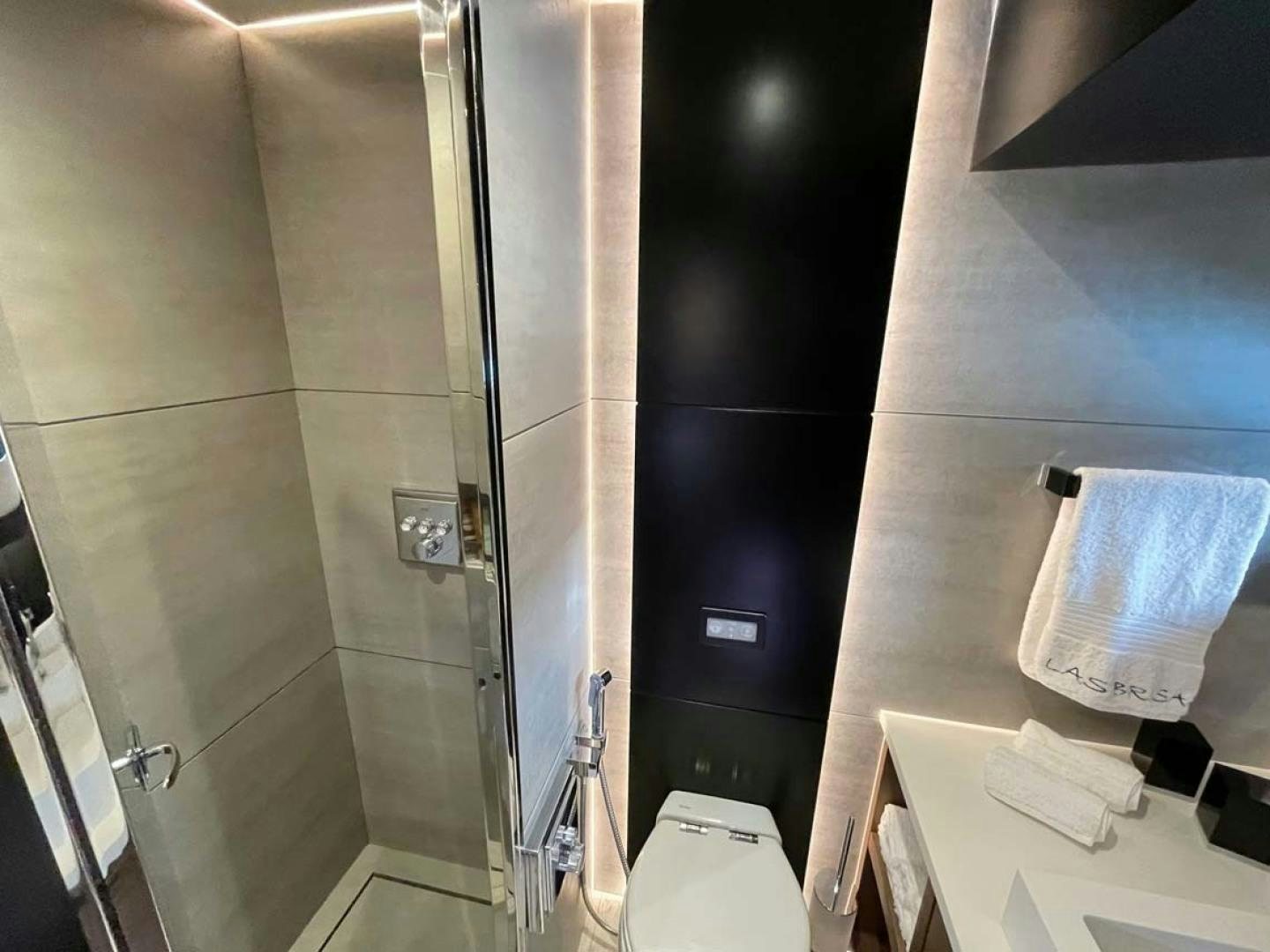 a bathroom with a glass shower aboard LAS BRISAS Yacht for Sale