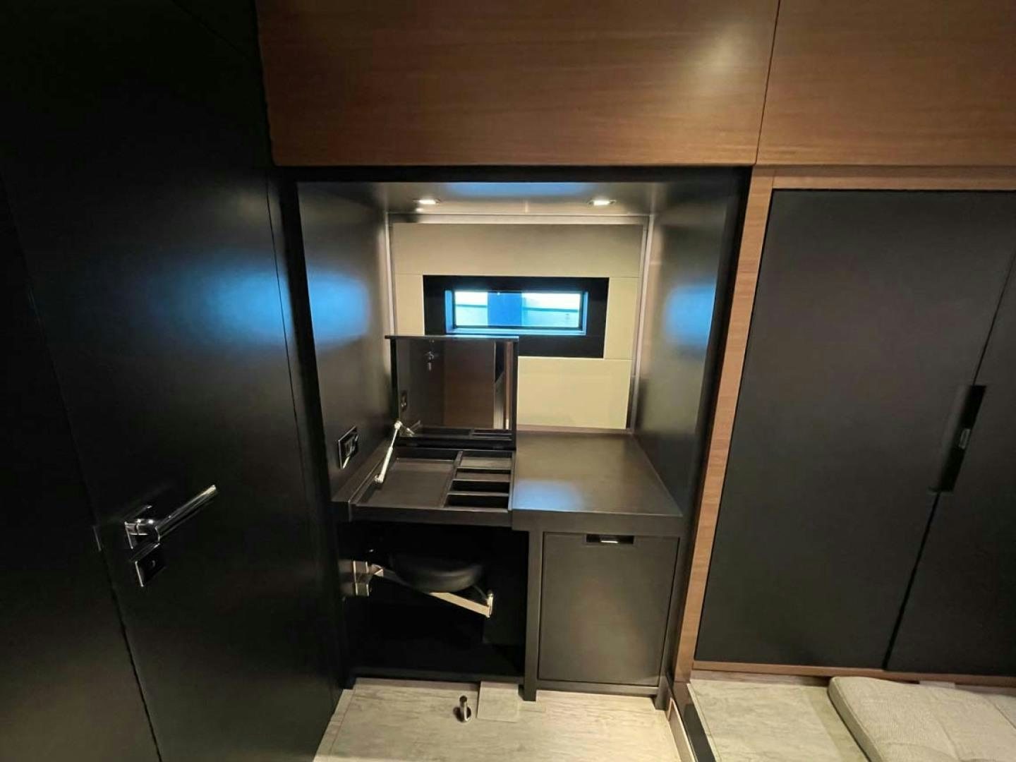 a kitchen with a large black cabinet aboard LAS BRISAS Yacht for Sale