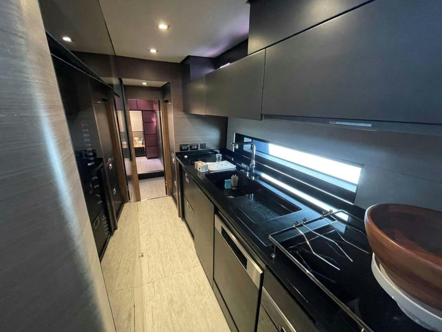 a kitchen with a large island aboard LAS BRISAS Yacht for Sale