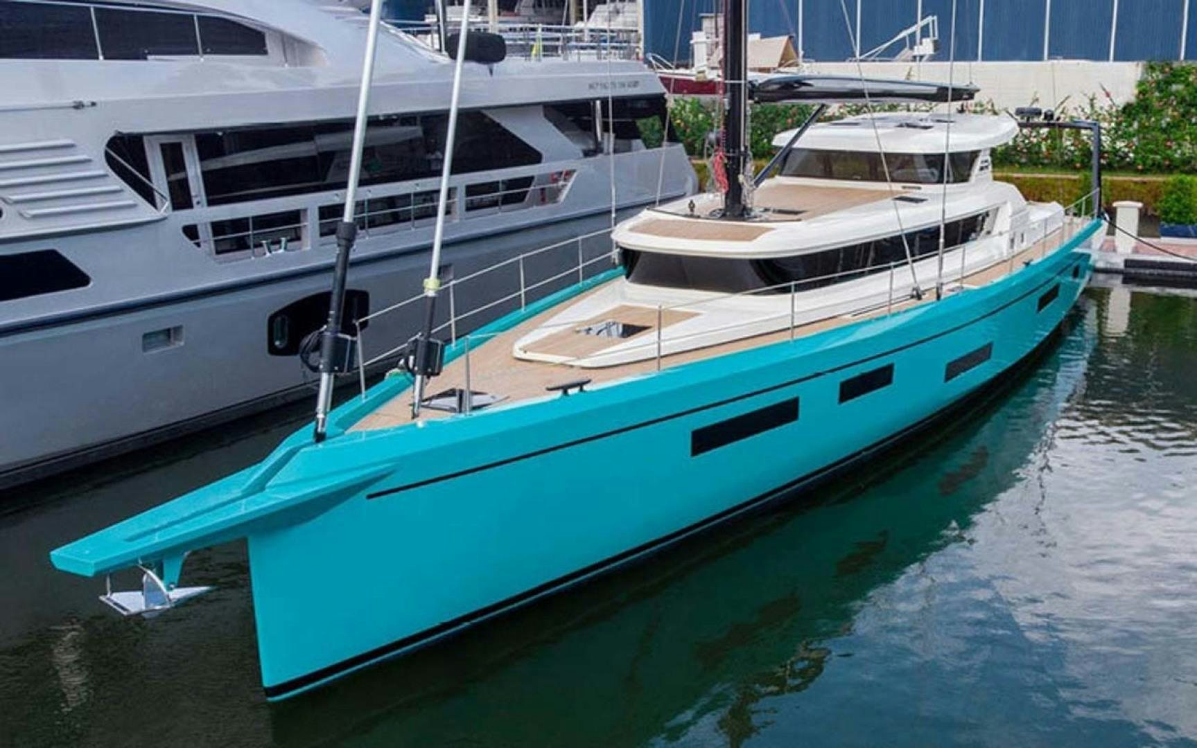 several boats docked in a harbor aboard LAS BRISAS Yacht for Sale