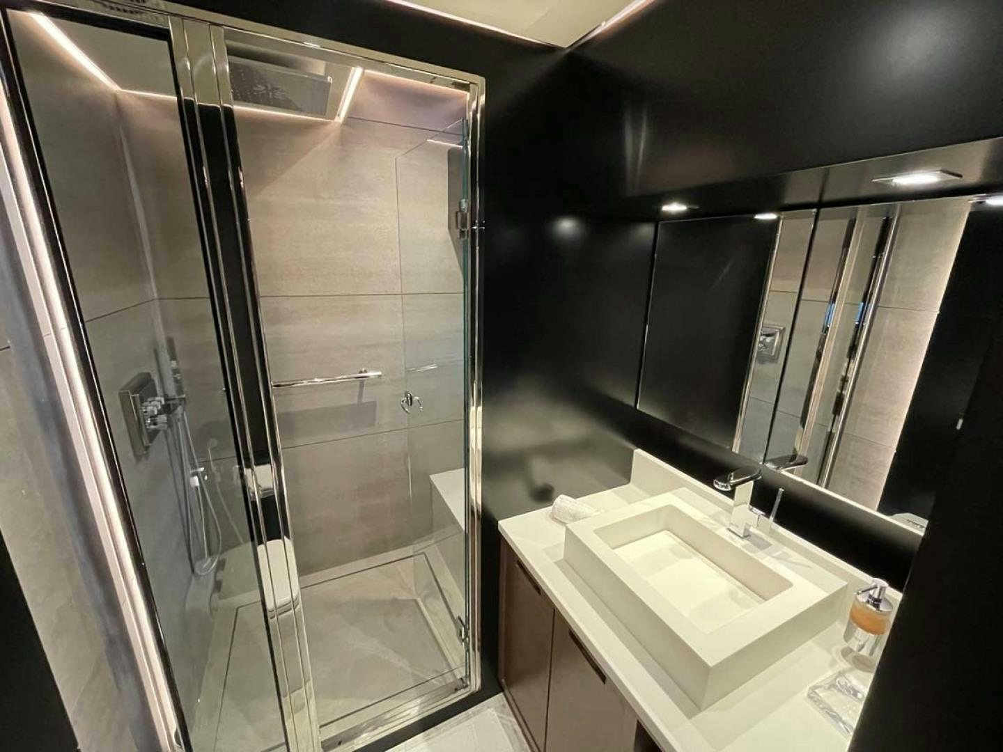 a bathroom with a glass shower aboard LAS BRISAS Yacht for Sale