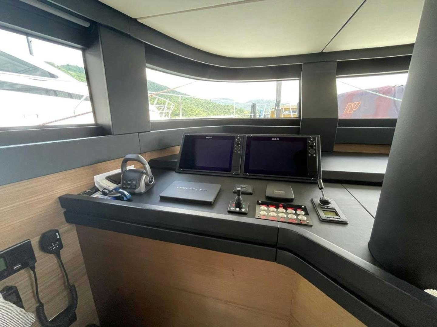 a desk with a laptop and a monitor on it aboard LAS BRISAS Yacht for Sale