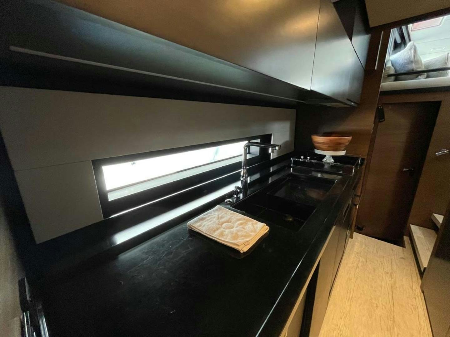 a kitchen with a stove and a sink aboard LAS BRISAS Yacht for Sale