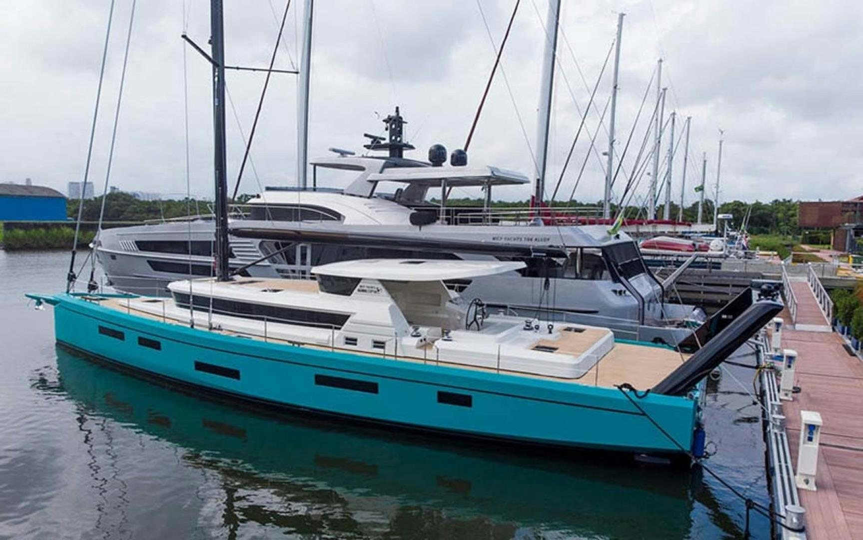 a boat docked at a pier aboard LAS BRISAS Yacht for Sale