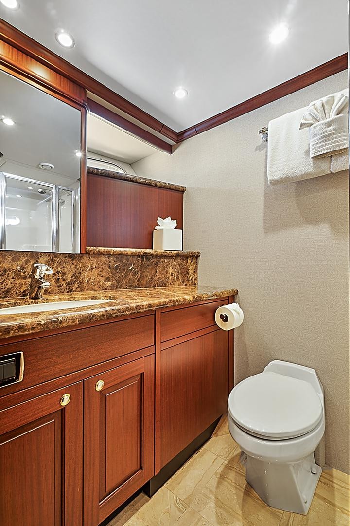 a bathroom with a toilet and a sink aboard LADY B Yacht for Sale
