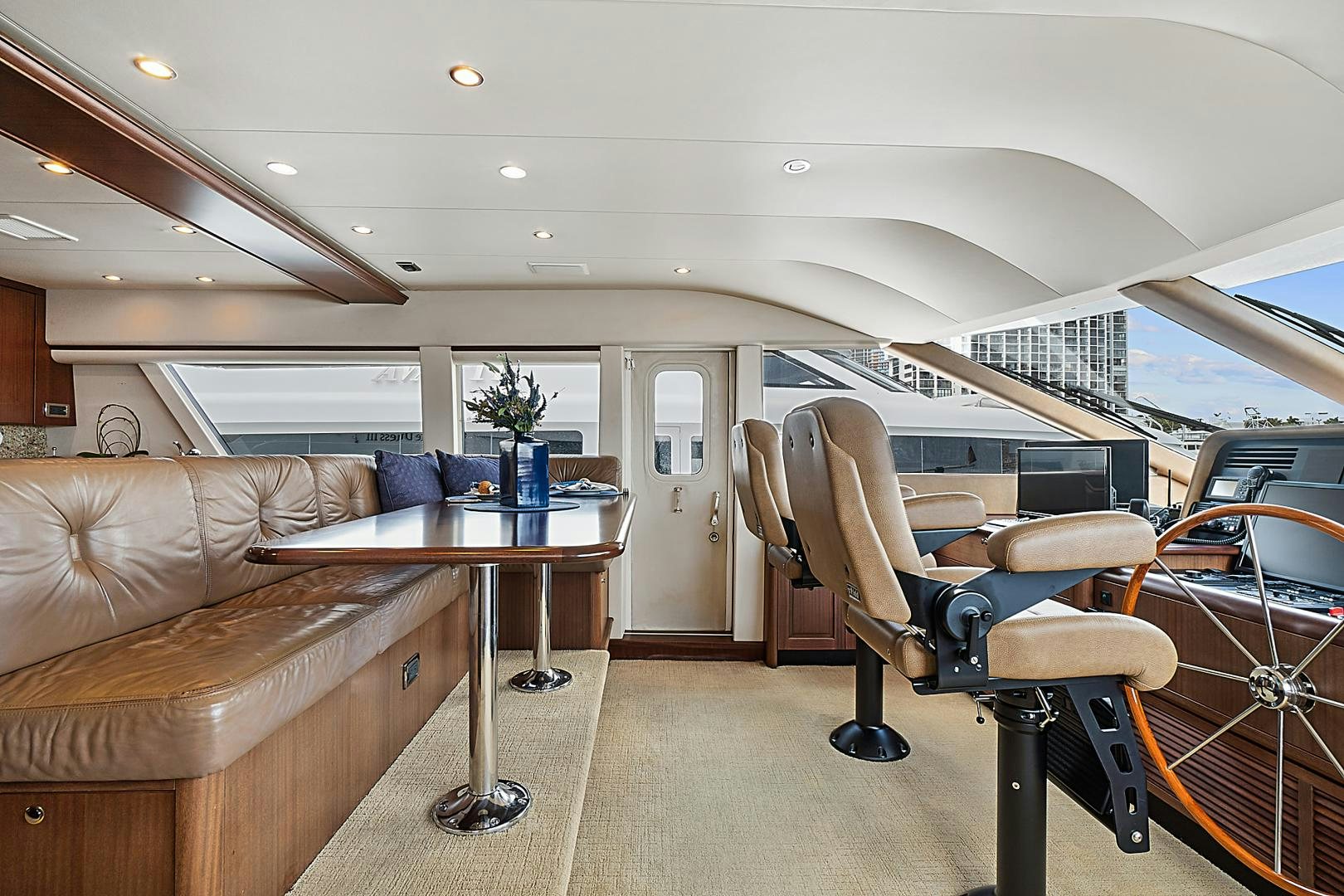 a large living room with a couch and a table aboard LADY B Yacht for Sale