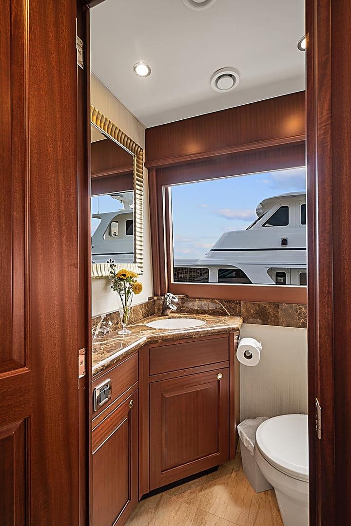 a bathroom with a large window aboard LADY B Yacht for Sale