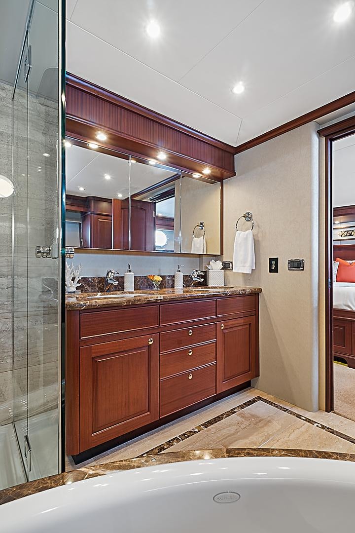 a bathroom with a large mirror aboard LADY B Yacht for Sale