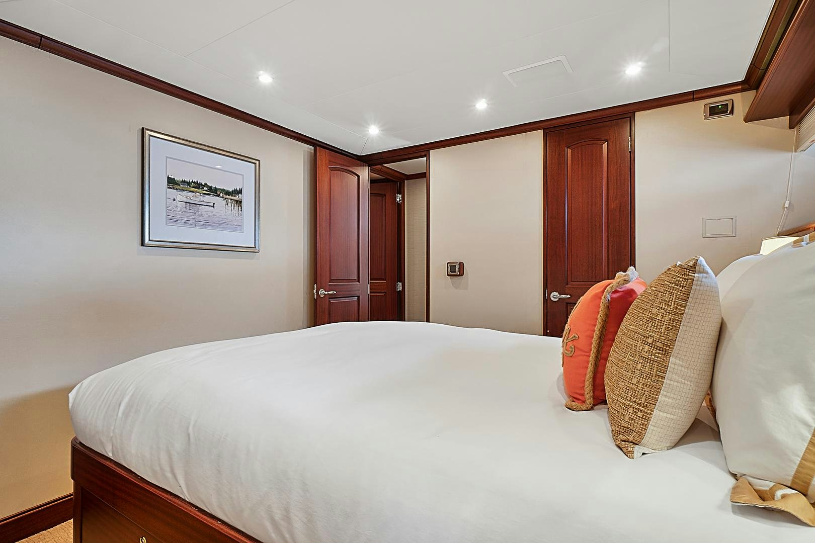 a bed with pillows on it aboard LADY B Yacht for Sale