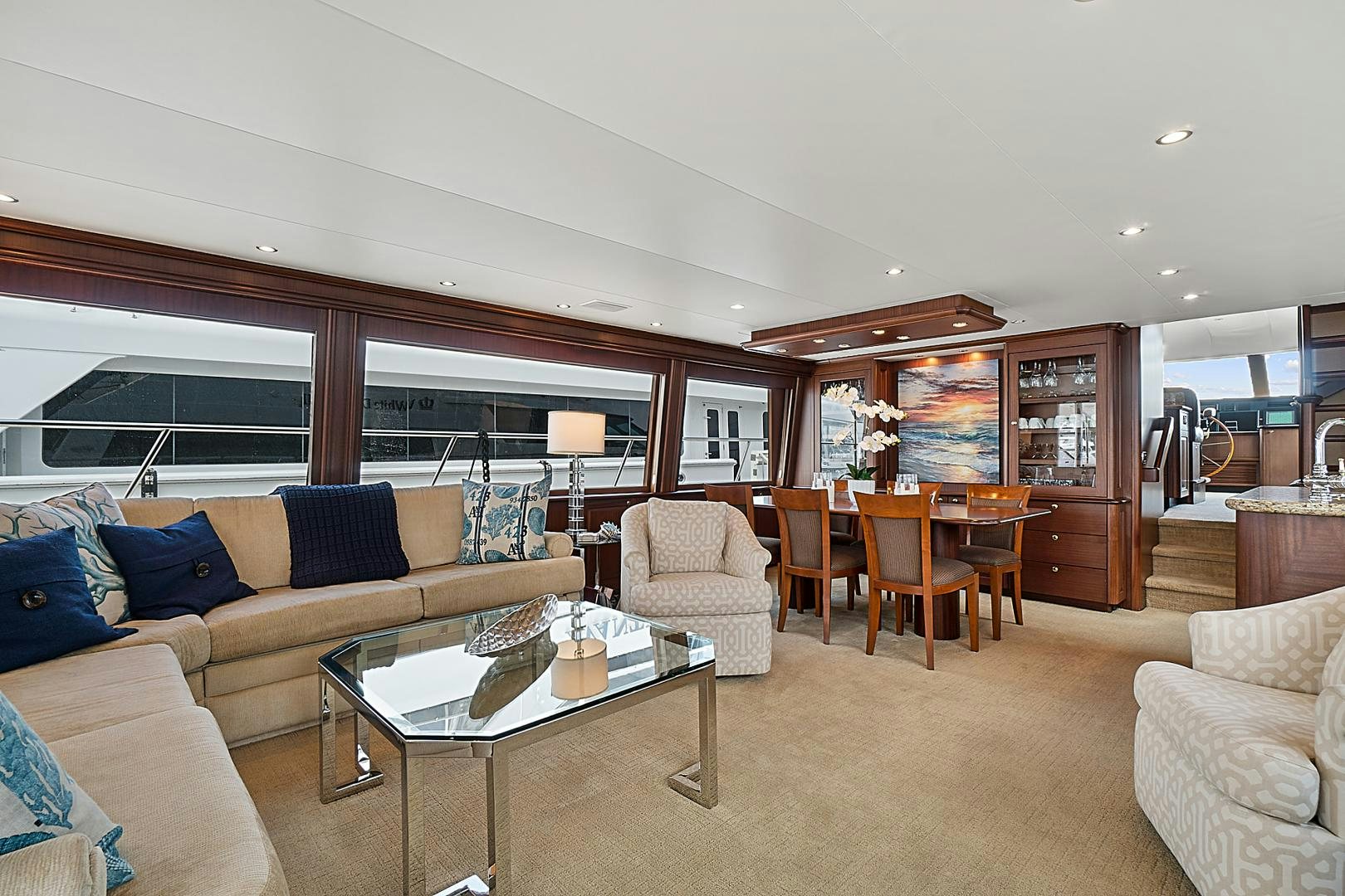 a living room with a couch and a coffee table aboard LADY B Yacht for Sale