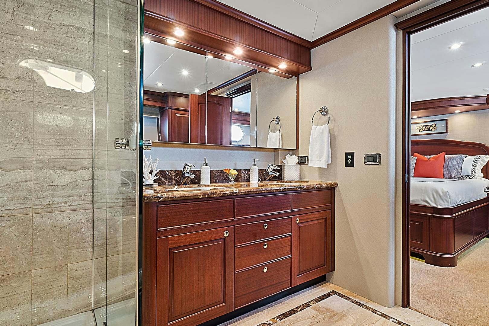 a bathroom with a glass shower aboard LADY B Yacht for Sale