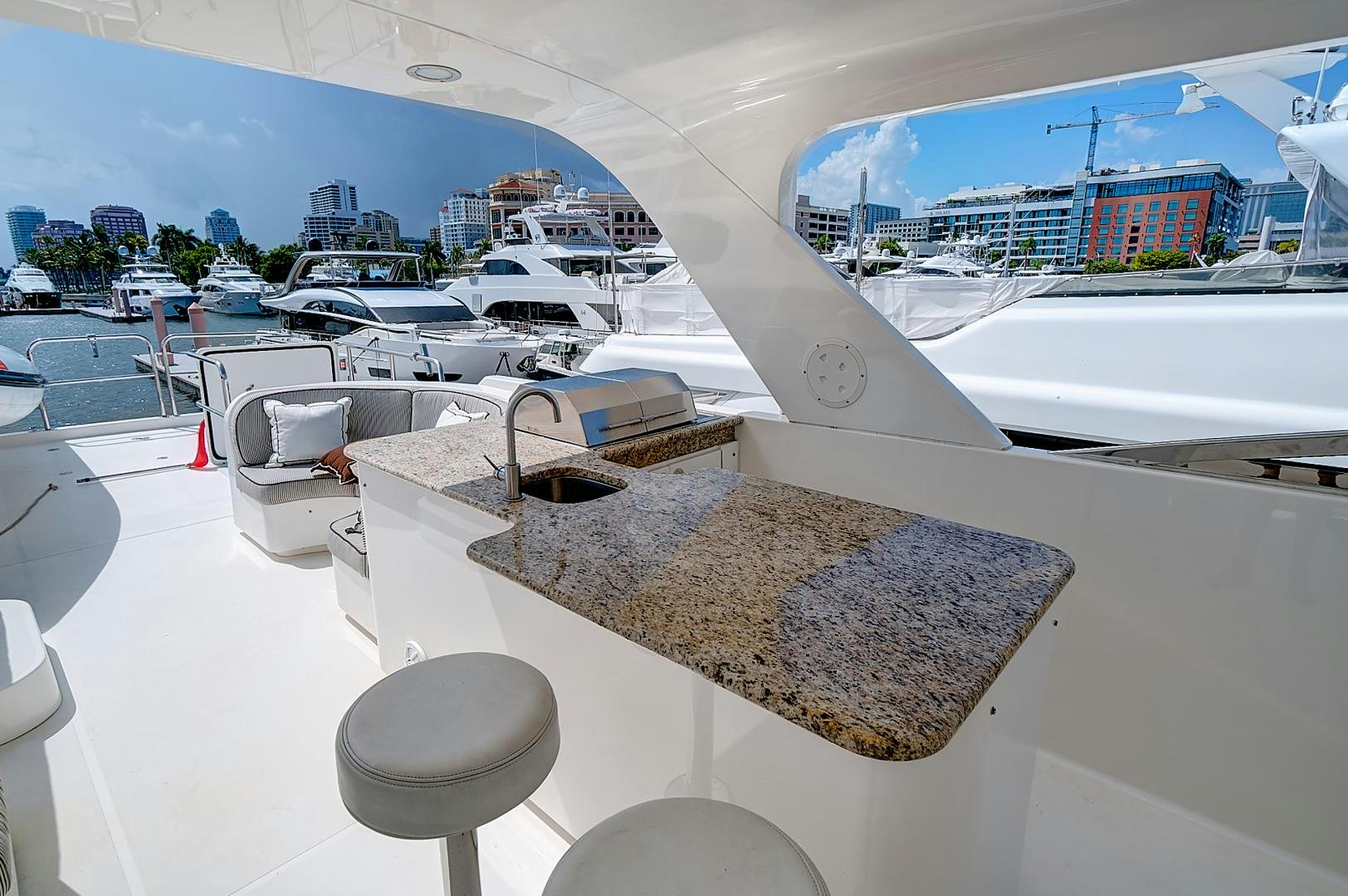 a room with a view of a city and boats aboard LADY B Yacht for Sale