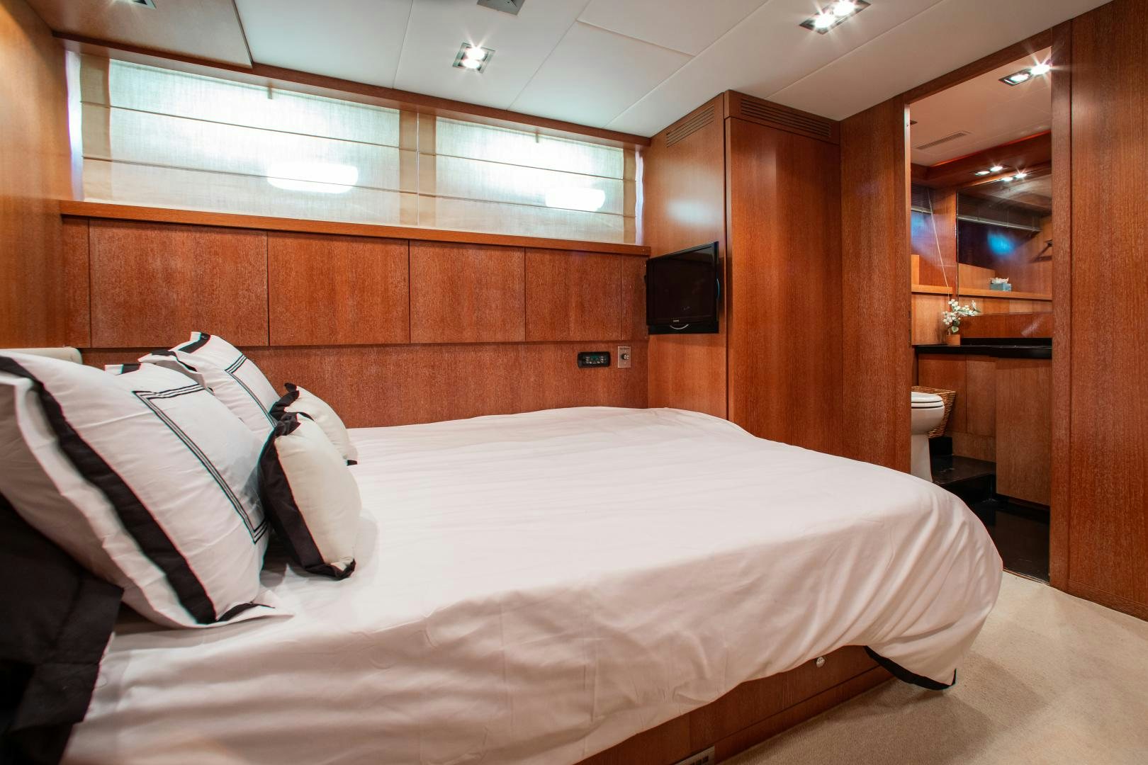 a bed in a room aboard SMILE Yacht for Sale