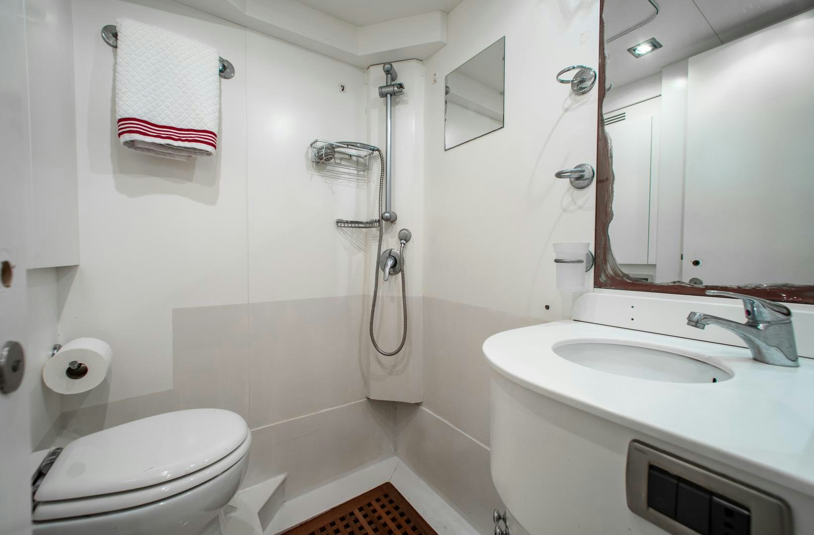 a bathroom with a sink and a toilet aboard SMILE Yacht for Charter