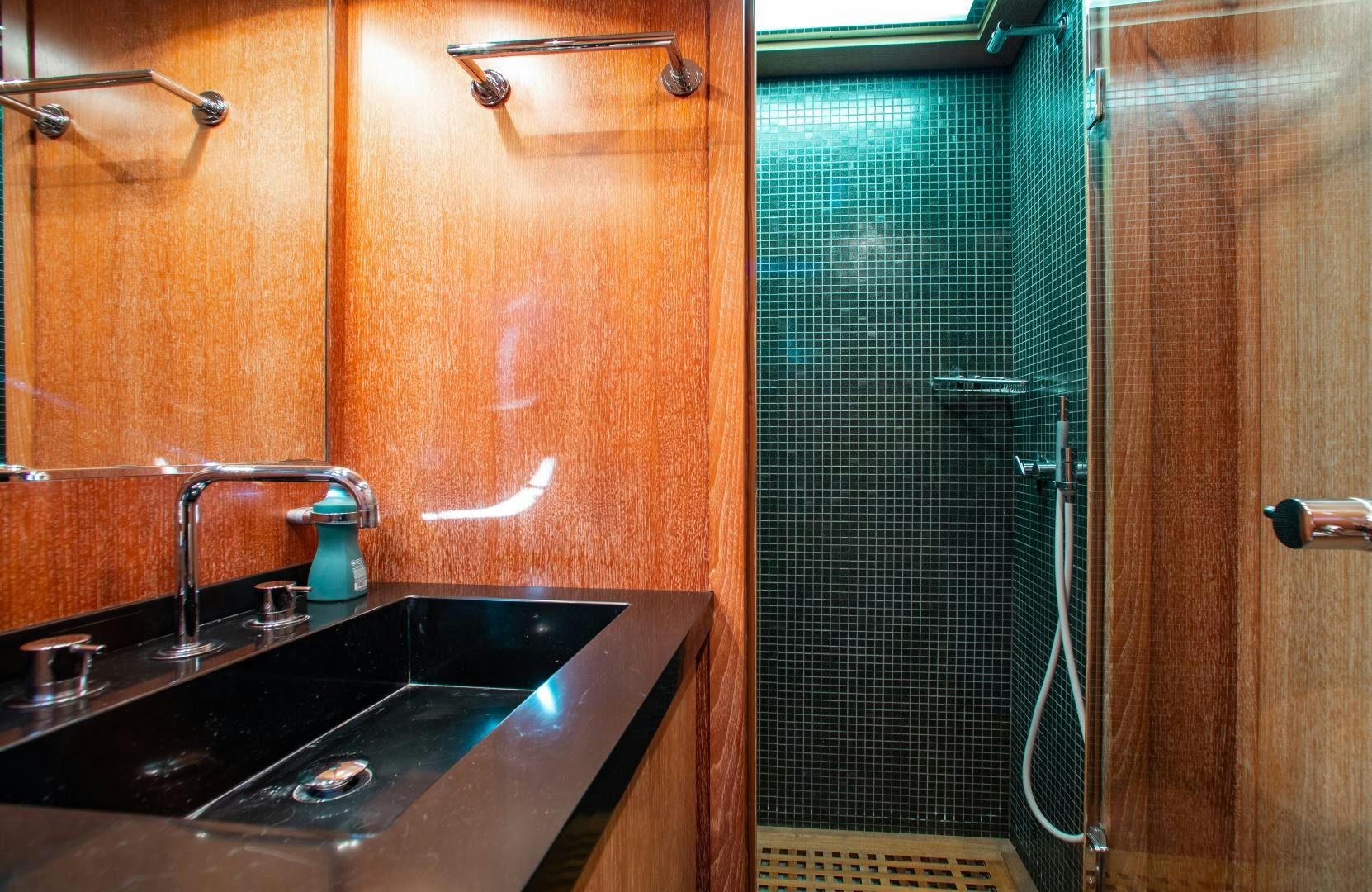 a bathroom with a sink and a shower aboard SMILE Yacht for Sale