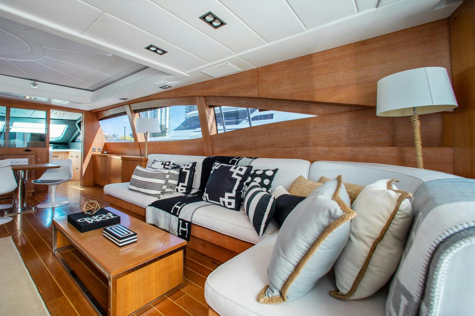 a living room with a couch and a coffee table aboard SMILE Yacht for Charter