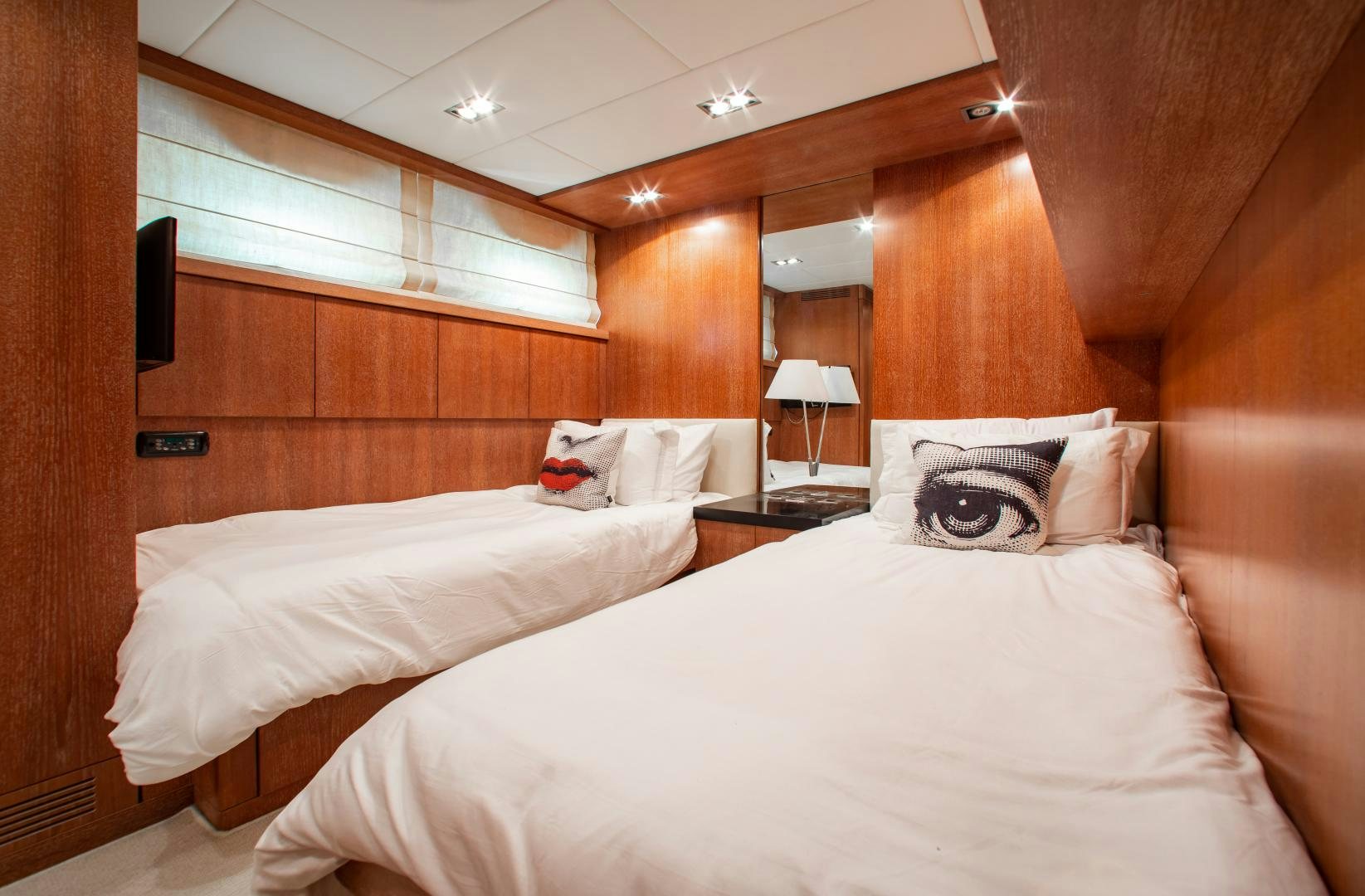 a room with a bed and a desk aboard SMILE Yacht for Charter