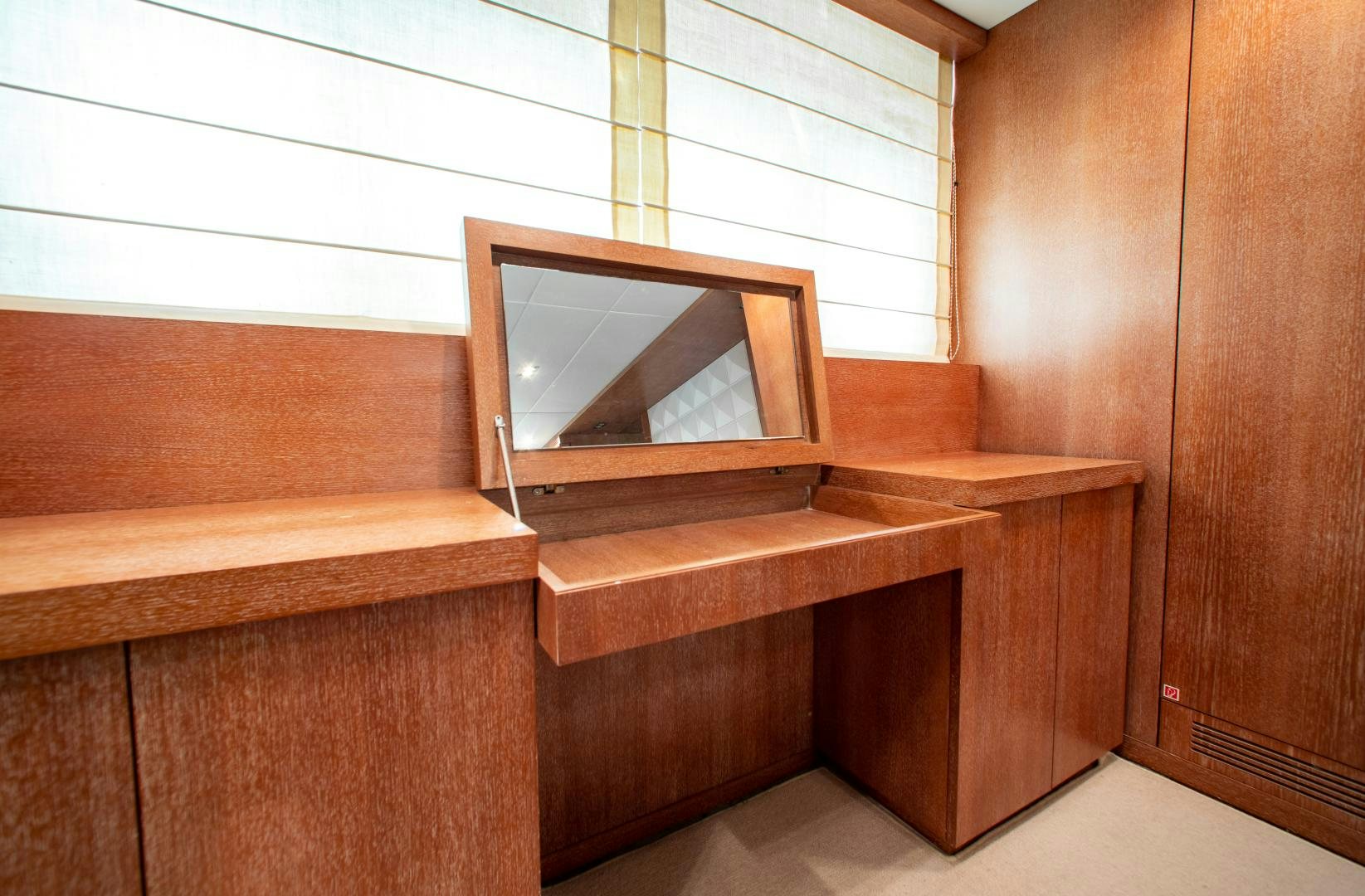 a tv on a wooden stand aboard SMILE Yacht for Charter