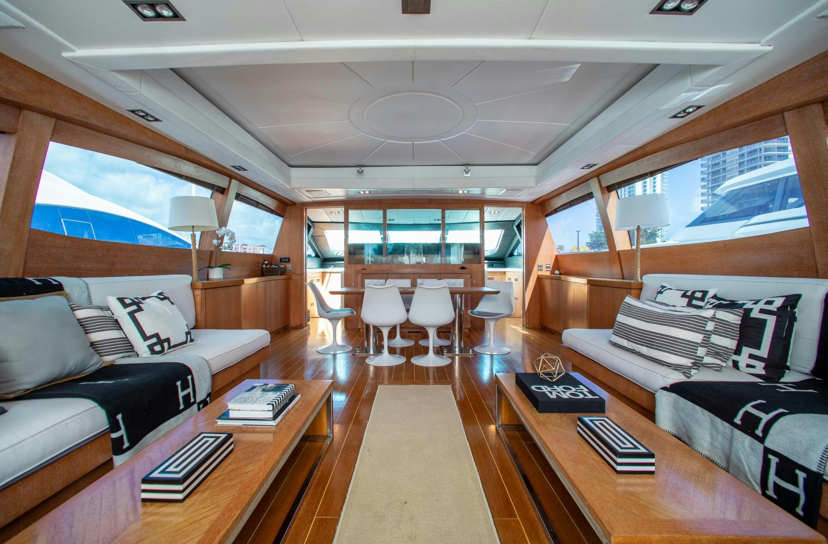 a room with a couch and a table and chairs aboard SMILE Yacht for Charter