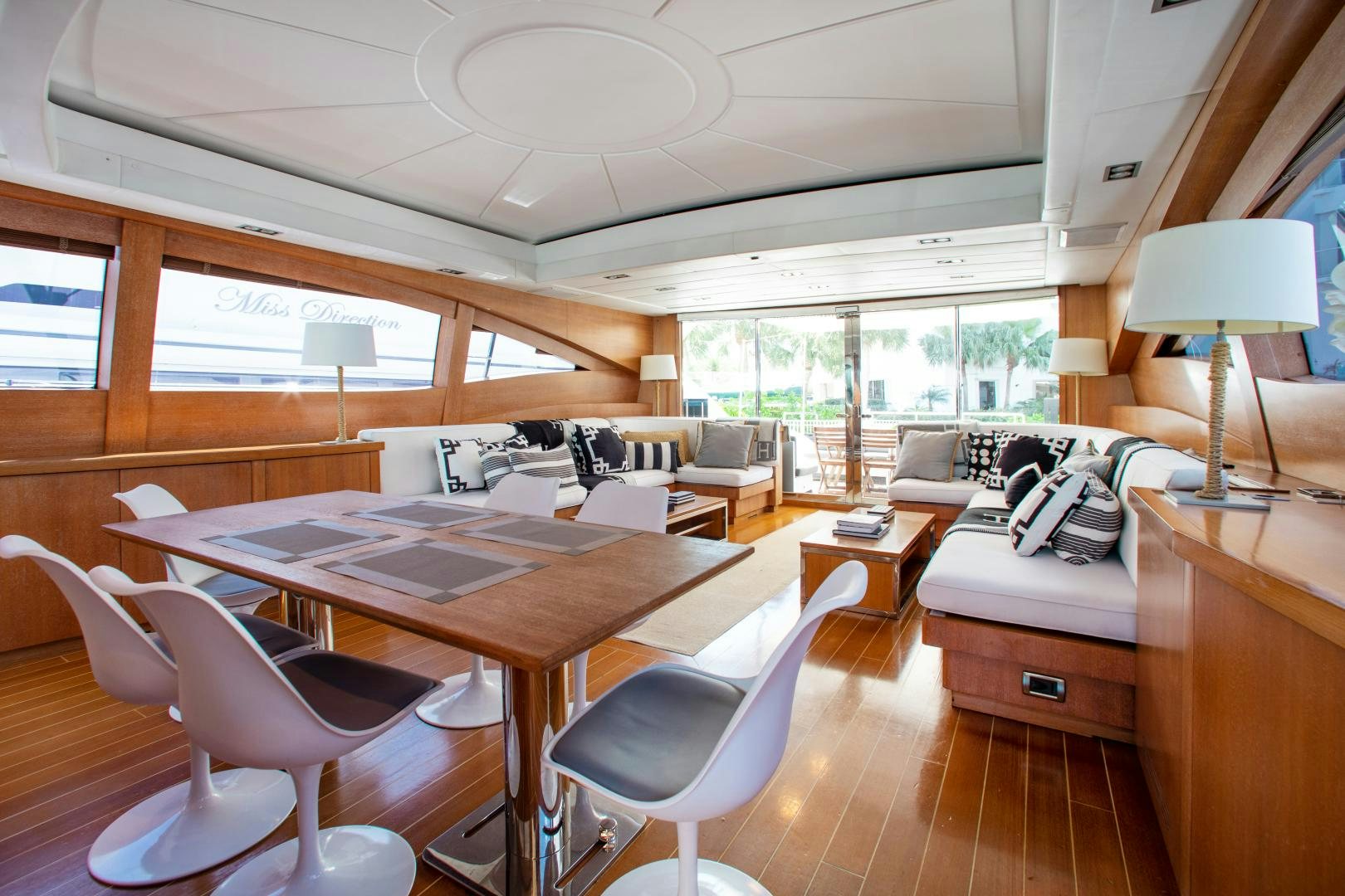 a room with a table chairs and a bed aboard SMILE Yacht for Sale