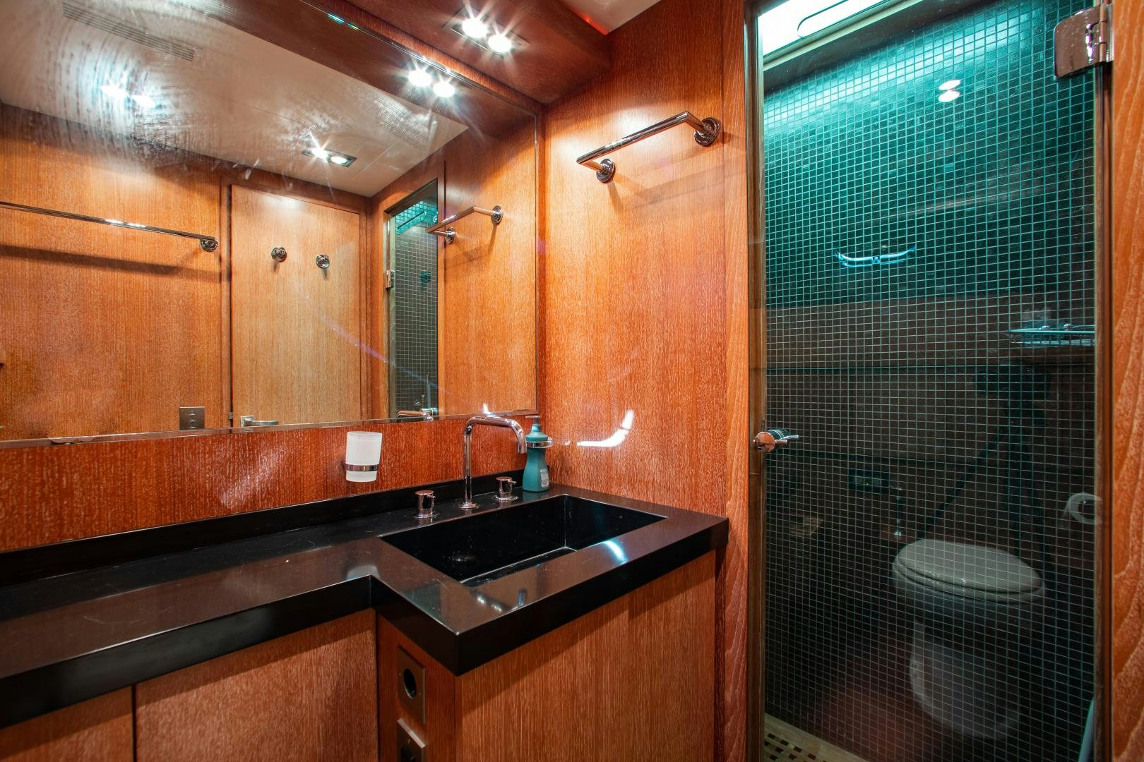 a bathroom with a glass shower aboard SMILE Yacht for Sale