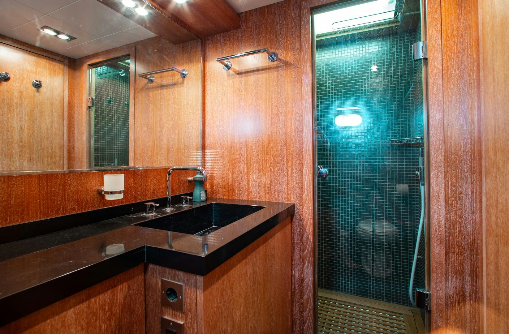 a bathroom with a sink and a mirror aboard SMILE Yacht for Sale