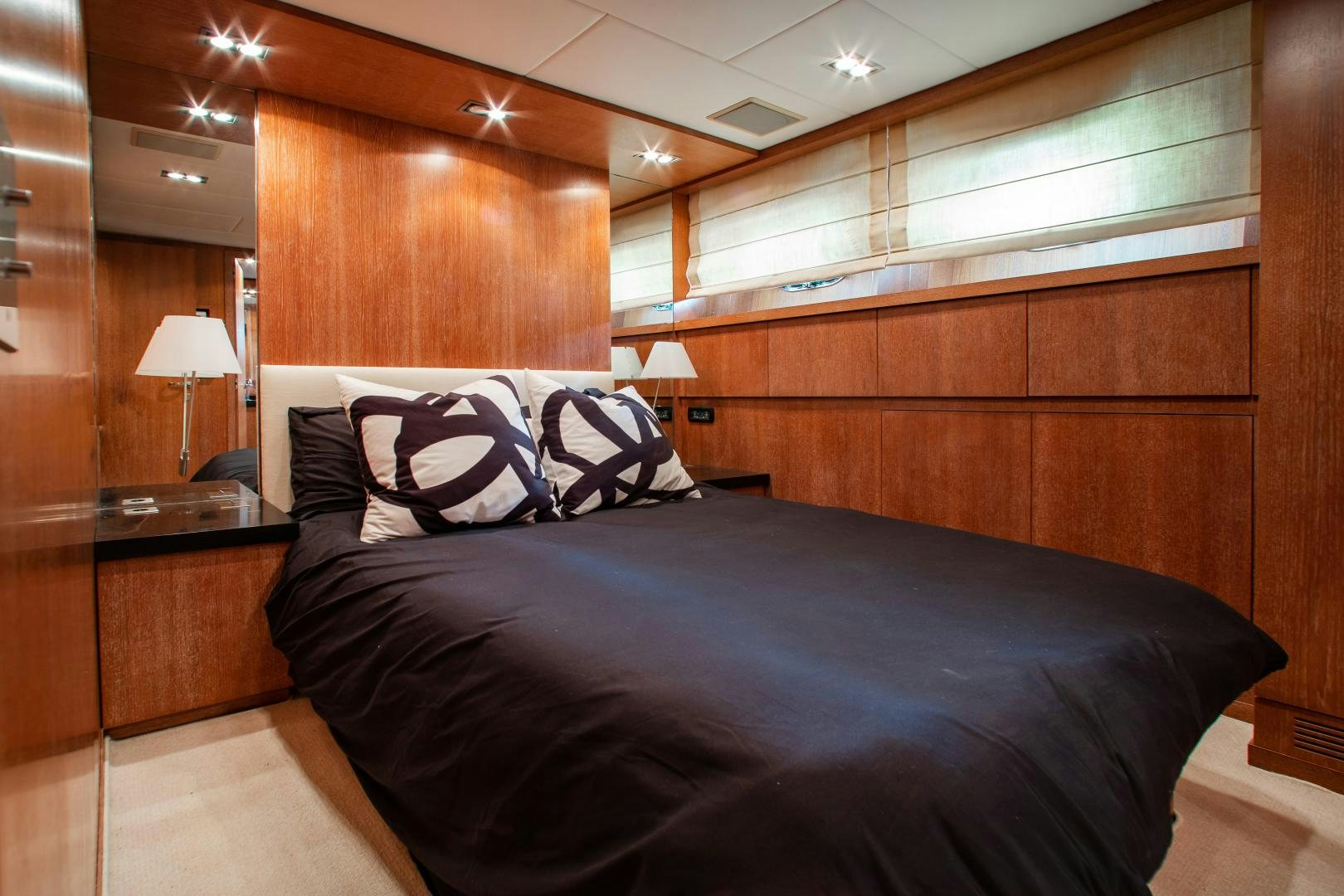a bed in a room aboard SMILE Yacht for Sale