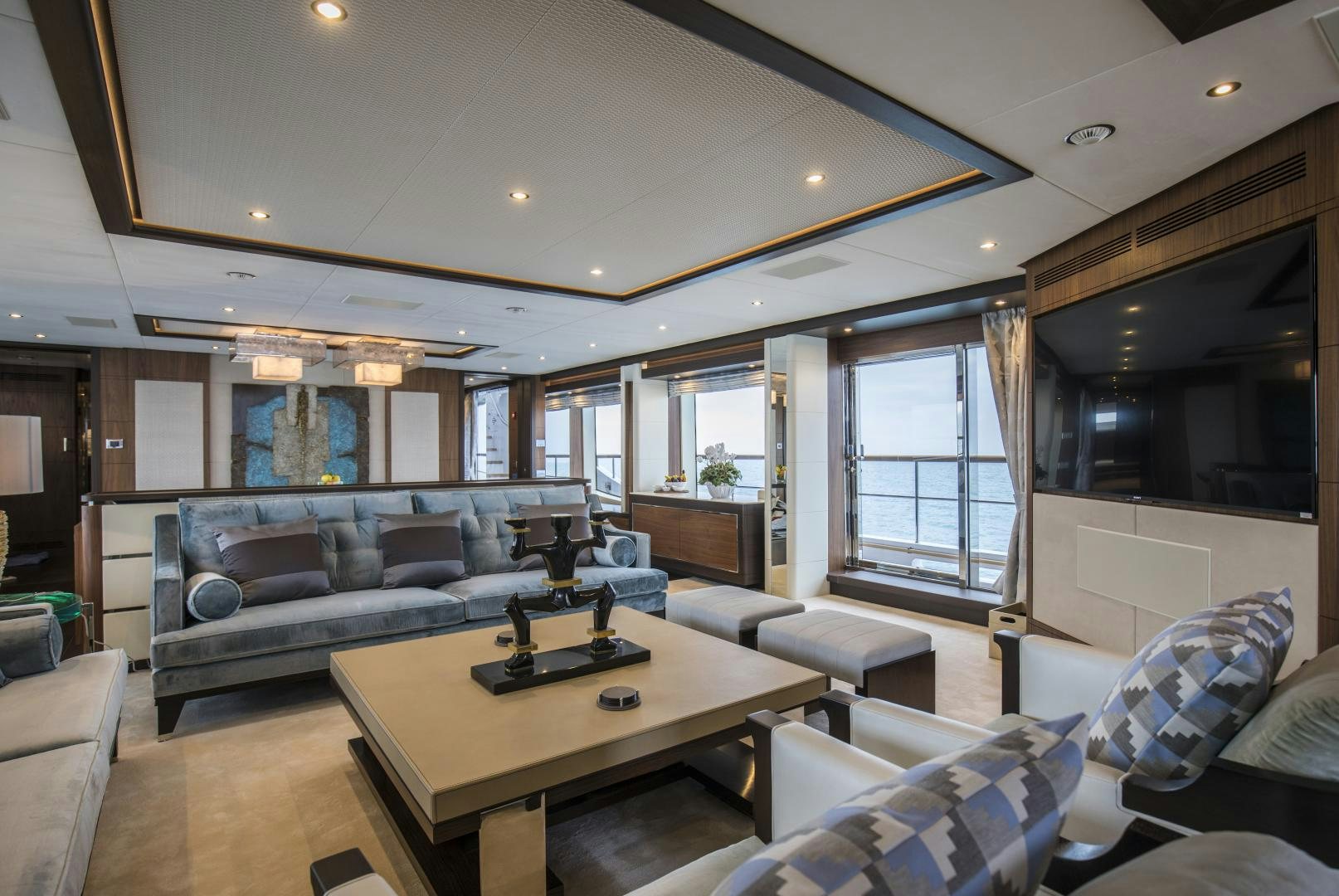 a living room with a couch and a coffee table aboard JODI ANN Yacht for Sale