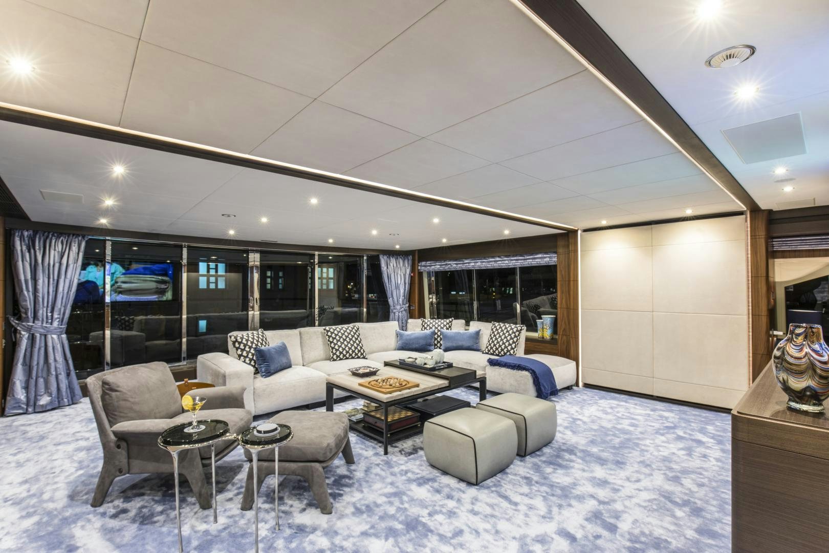 a living room with a large window aboard JODI ANN Yacht for Sale