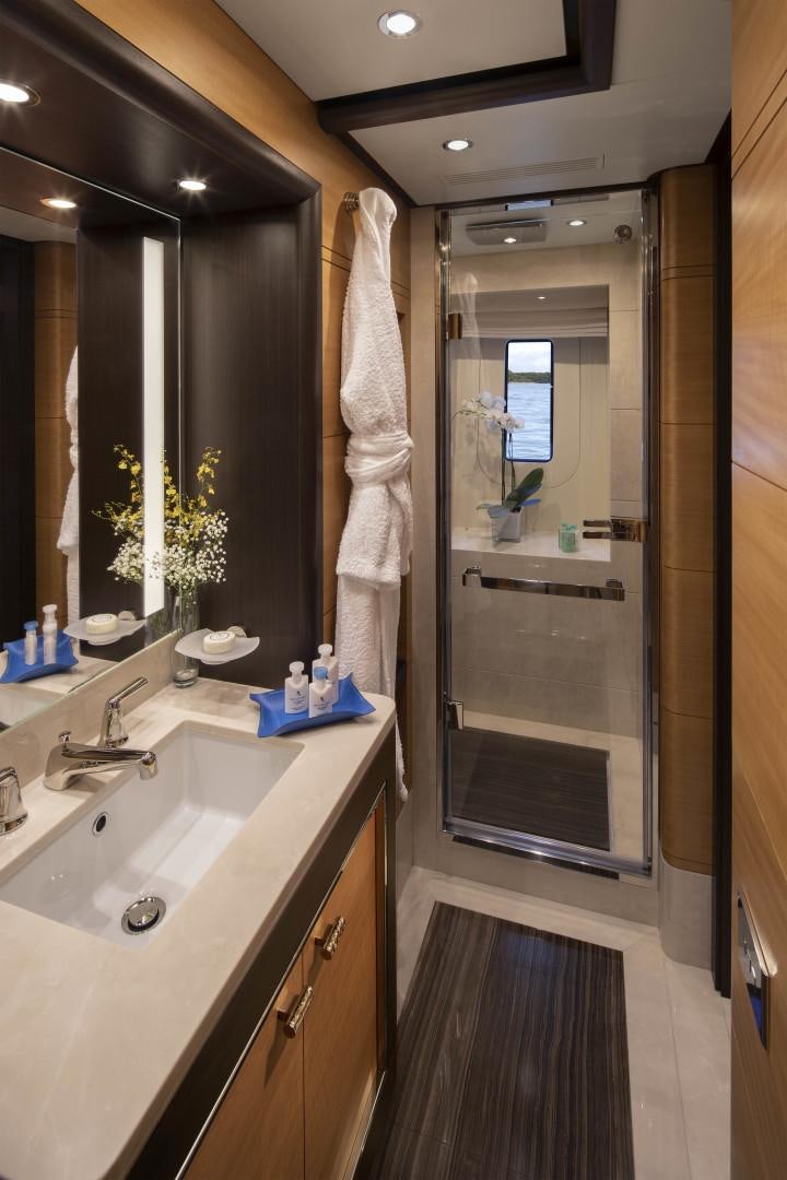 a bathroom with a glass shower aboard JODI ANN Yacht for Sale