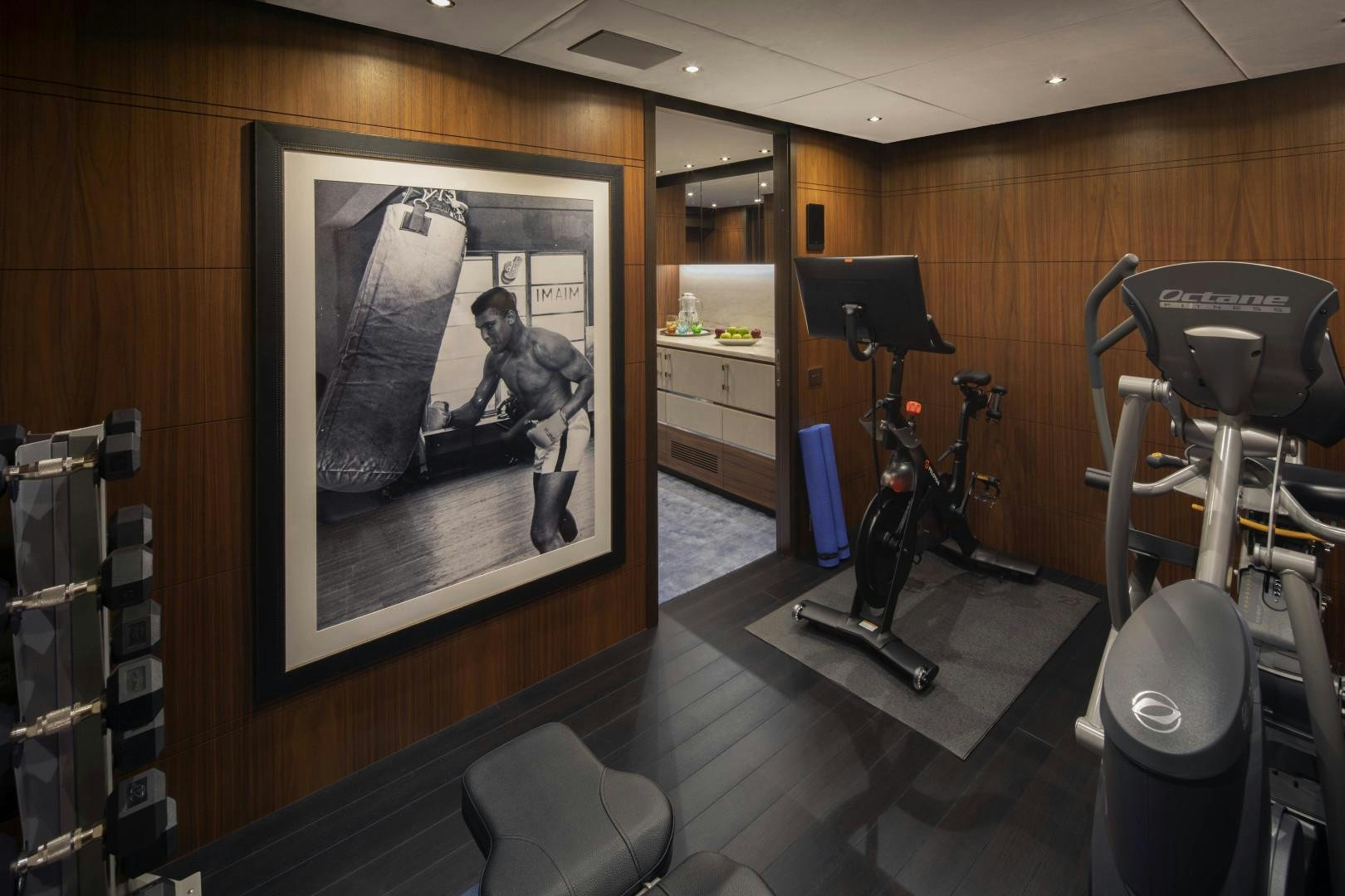 a room with a painting on the wall and chairs and a table aboard JODI ANN Yacht for Sale