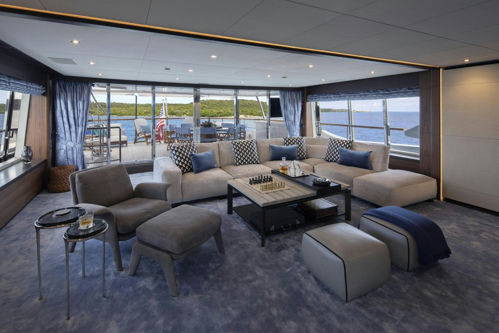 a living room with a large window aboard JODI ANN Yacht for Sale