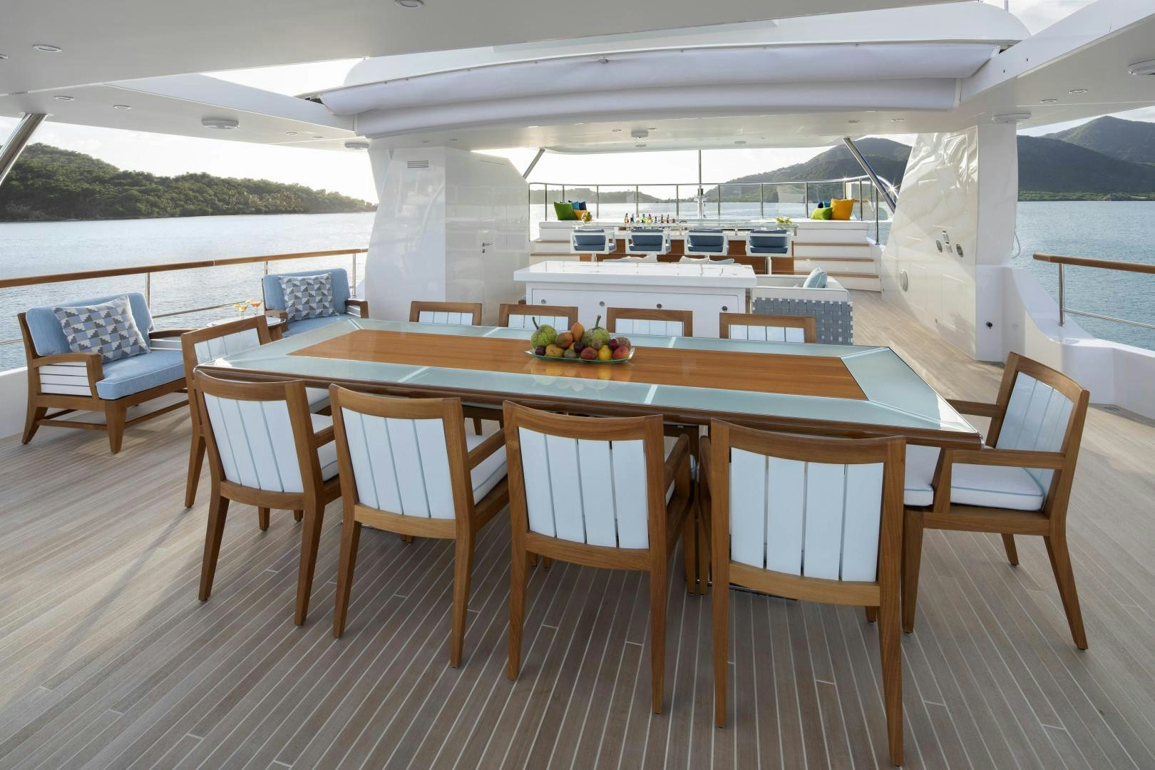 a table with chairs around it aboard JODI ANN Yacht for Sale