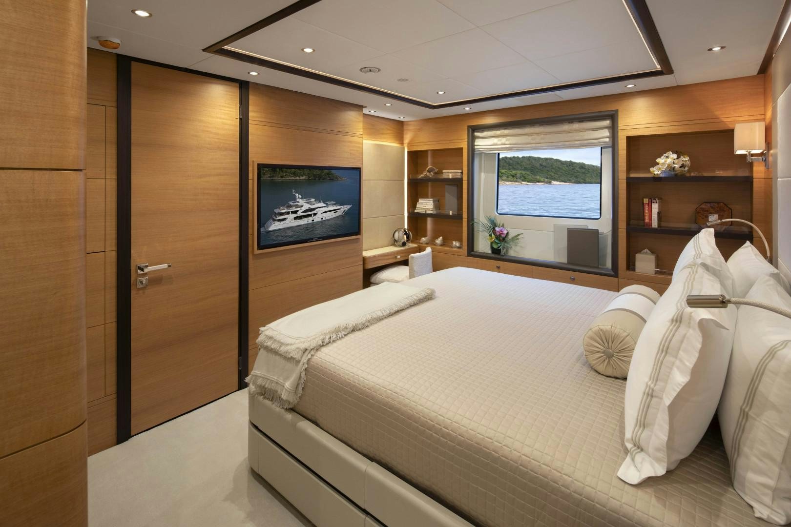 a room with a bed and a tv aboard JODI ANN Yacht for Sale