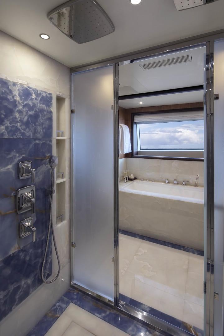 a bathroom with a glass shower aboard JODI ANN Yacht for Sale